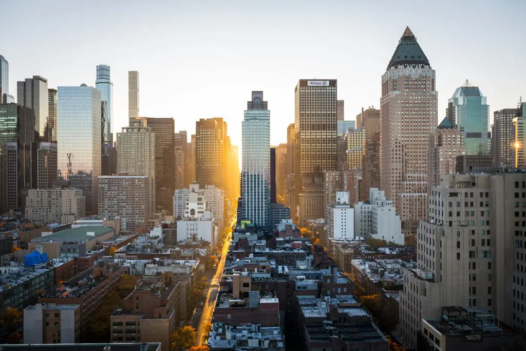 New York city skyline at dusk featuring towering skyscrapers and bustling streets